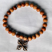 Wooden Stretch Bracelet
with Double Dorjee Pendant 